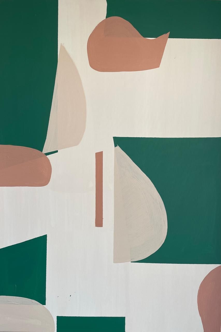 A close up of a green and white painting on a wall.
