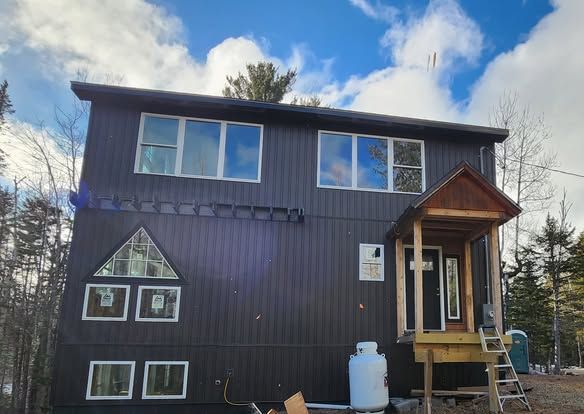 A house with a propane tank in front of it