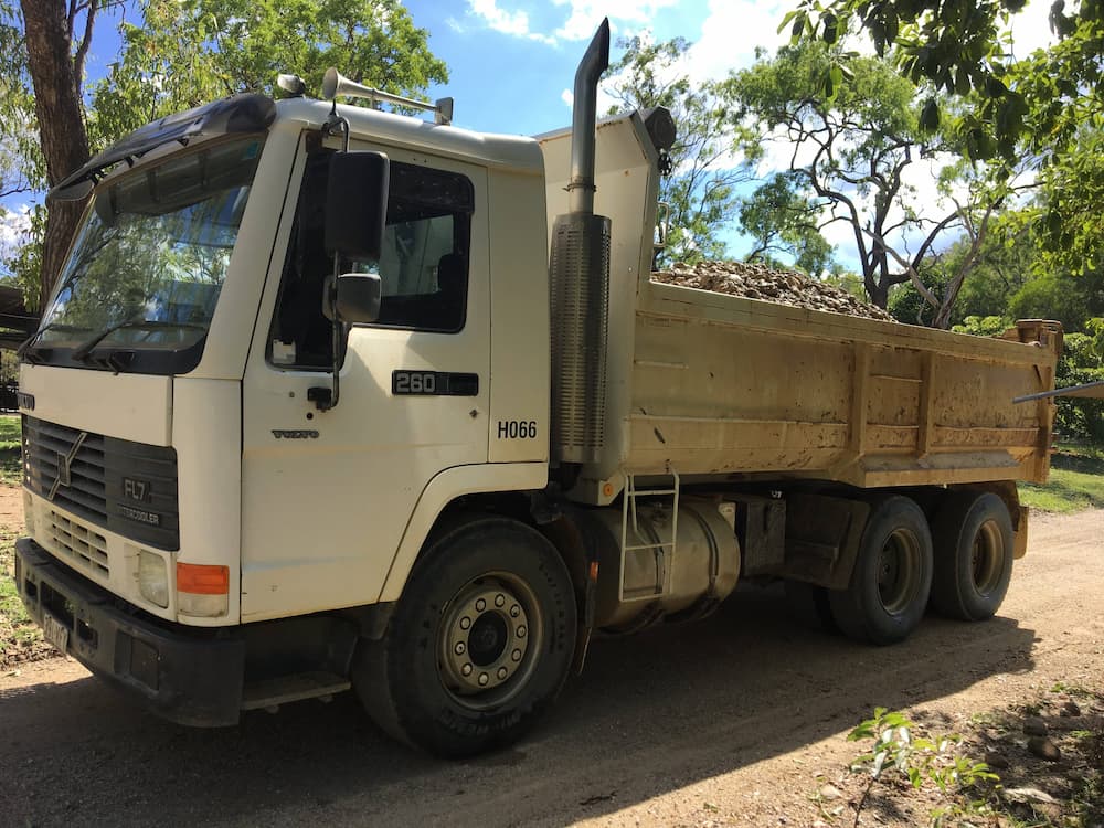 Truck Carrying Rocks — Riley Earthmoving in Deeragun, QLD
