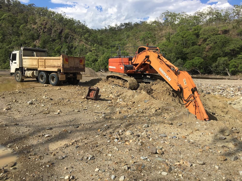Excavator Digging the Ground — Riley Earthmoving in Deeragun, QLD