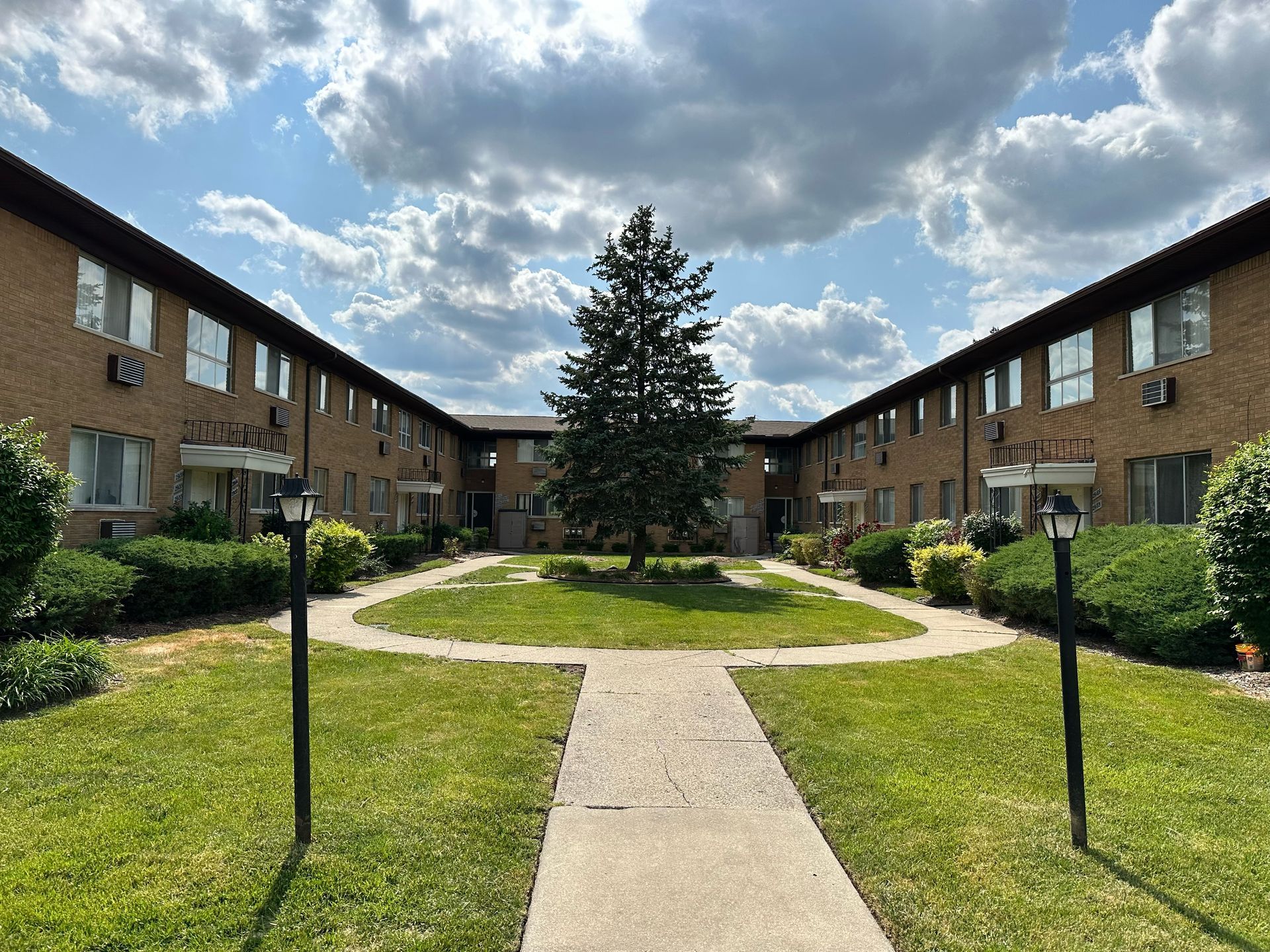 Building photo with courtyard in foreground and middleground