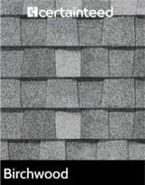 A black and white photo of a roof made of birchwood shingles.