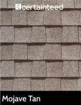A close up of a roof with shingles in the color mojave tan.