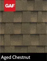 A picture of a roof with shingles in the color aged chestnut.
