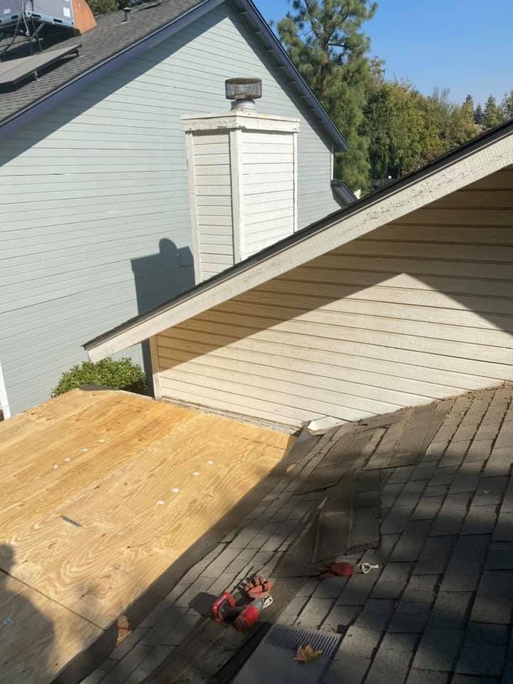 A house that is being built with a pile of dirt in front of it