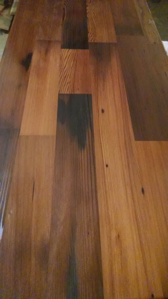 A close up of a wooden table with a lot of squares on it.