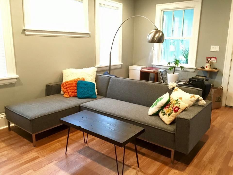 A living room with a couch and a coffee table