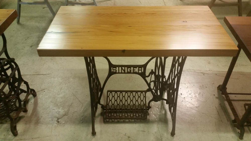 A custom table made out of a singer sewing machine