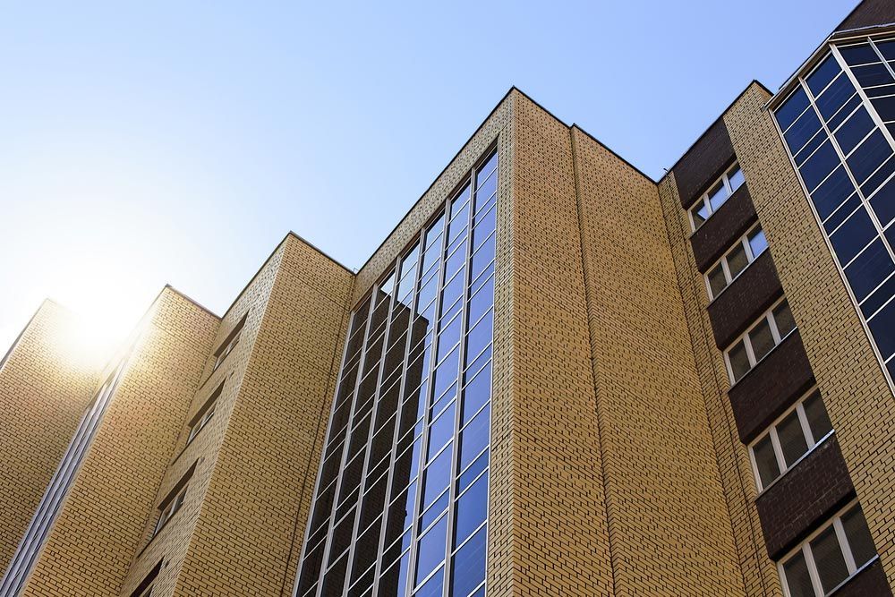 The Sun Is Shining Through The Windows Of A Tall Building — Tint a Car Sunshine Coast In Buderim, QLD