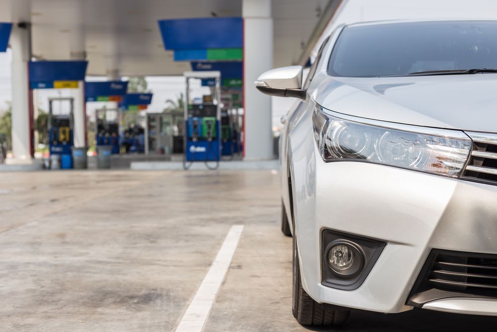 A Silver Car Is Parked In A Parking Lot At A Gas Station — Tint a Car Sunshine Coast In Buderim, QLD