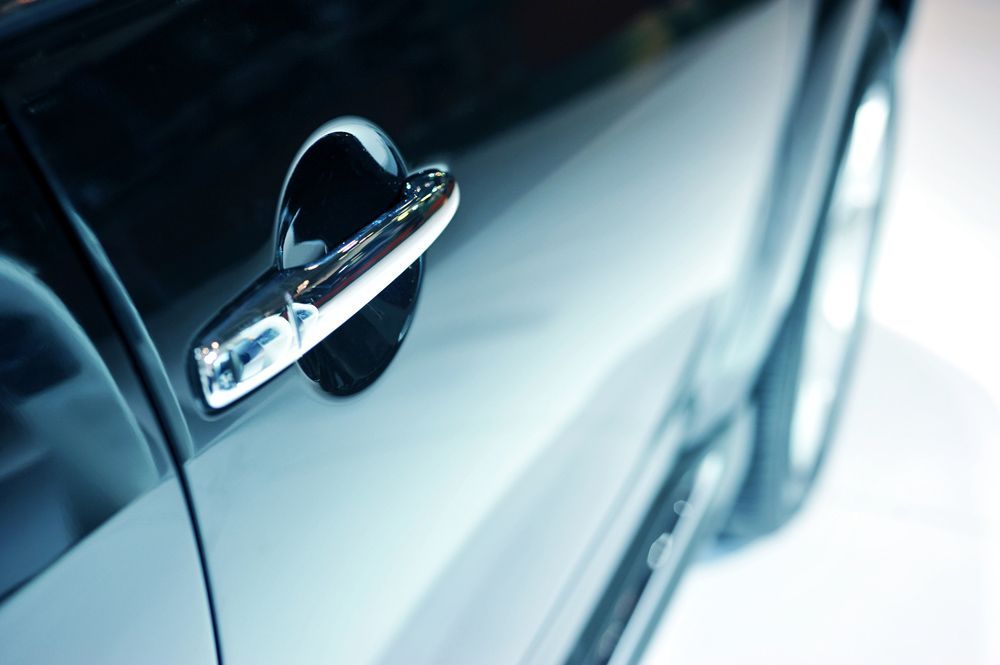 A Close Up Of A Car Door With A Chrome Handle — Tint a Car Sunshine Coast In Maroochydore, QLD