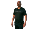 A man wearing a black life time t-shirt is standing in front of a white background.