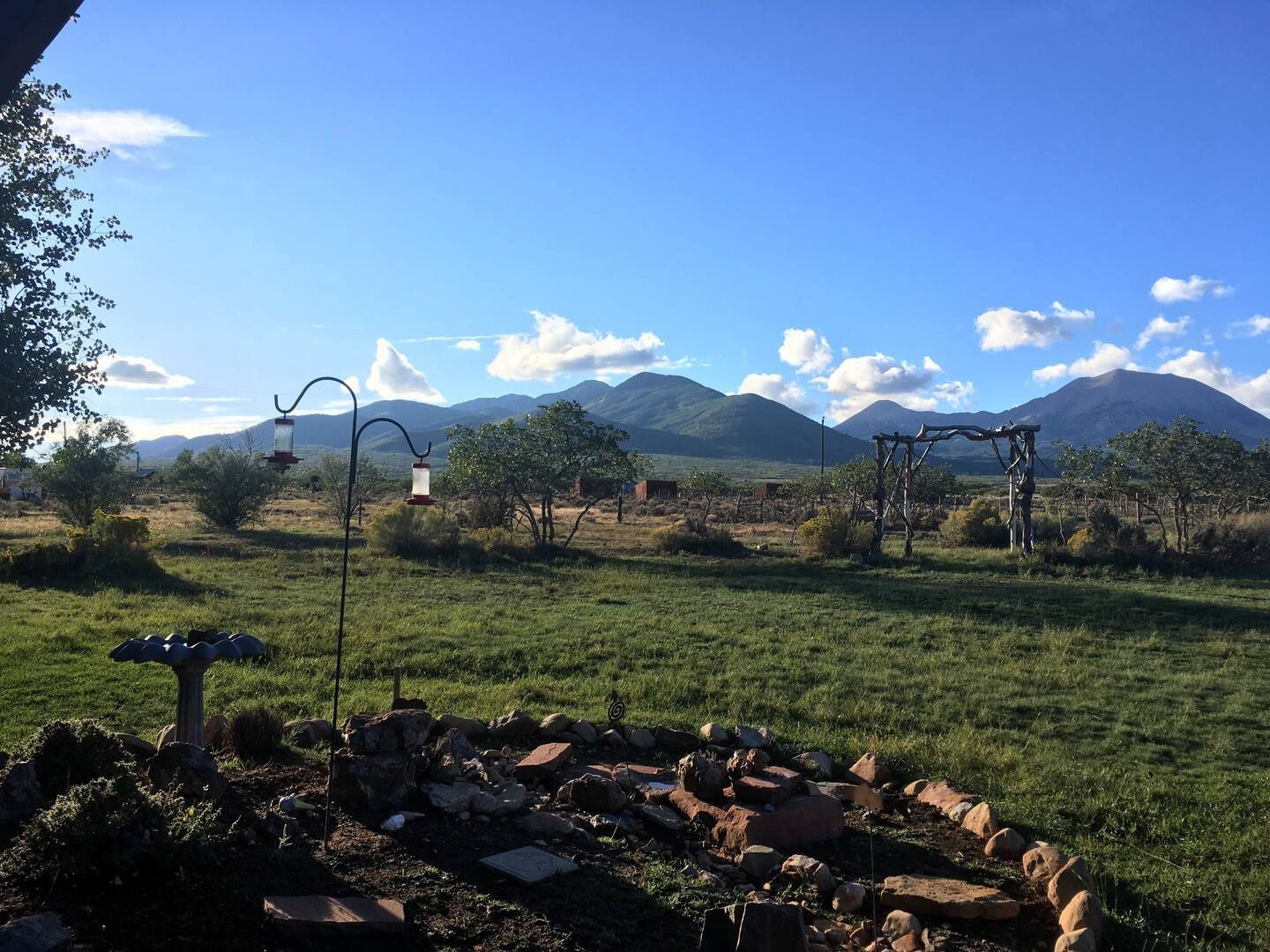 A view of a field with mountains in the background