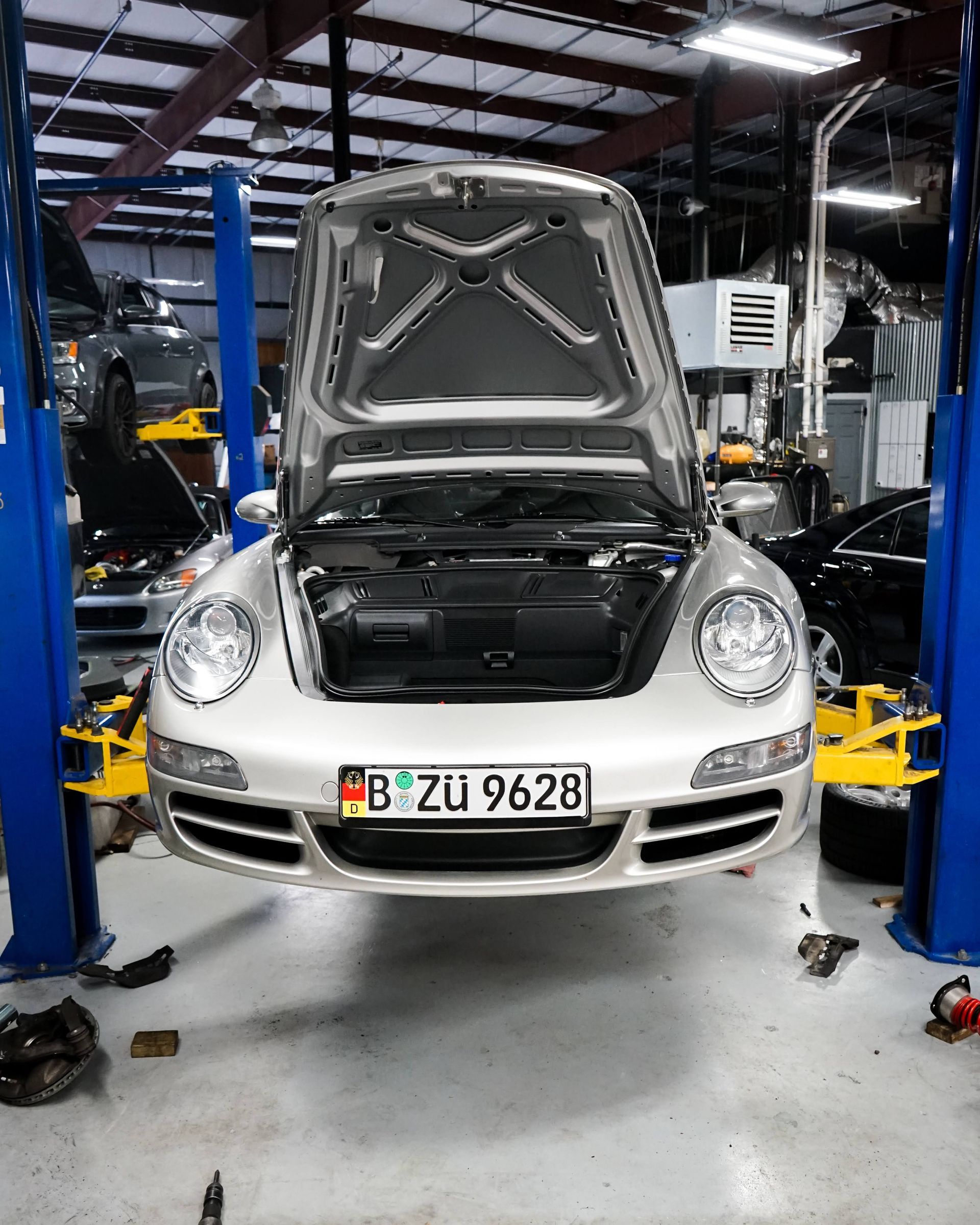 Silver Porsche on a lift | EuroSense