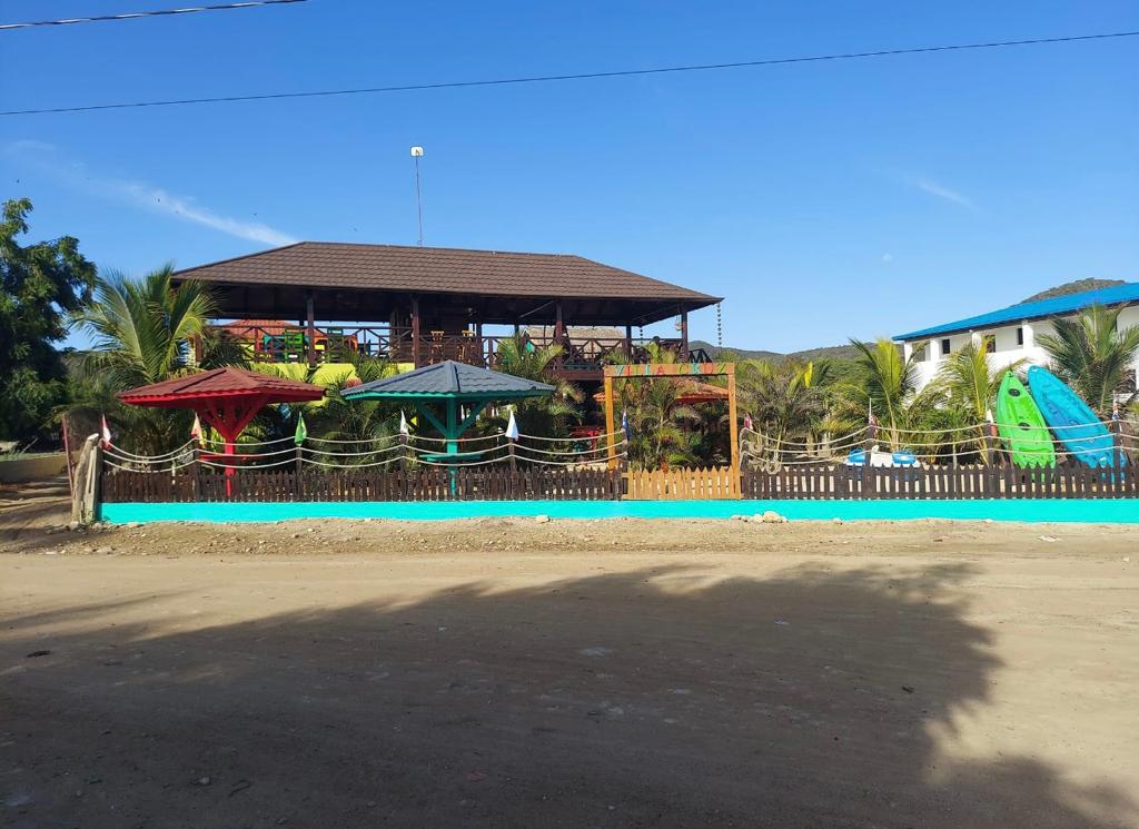 A blurred image of a house with umbrellas in front of it