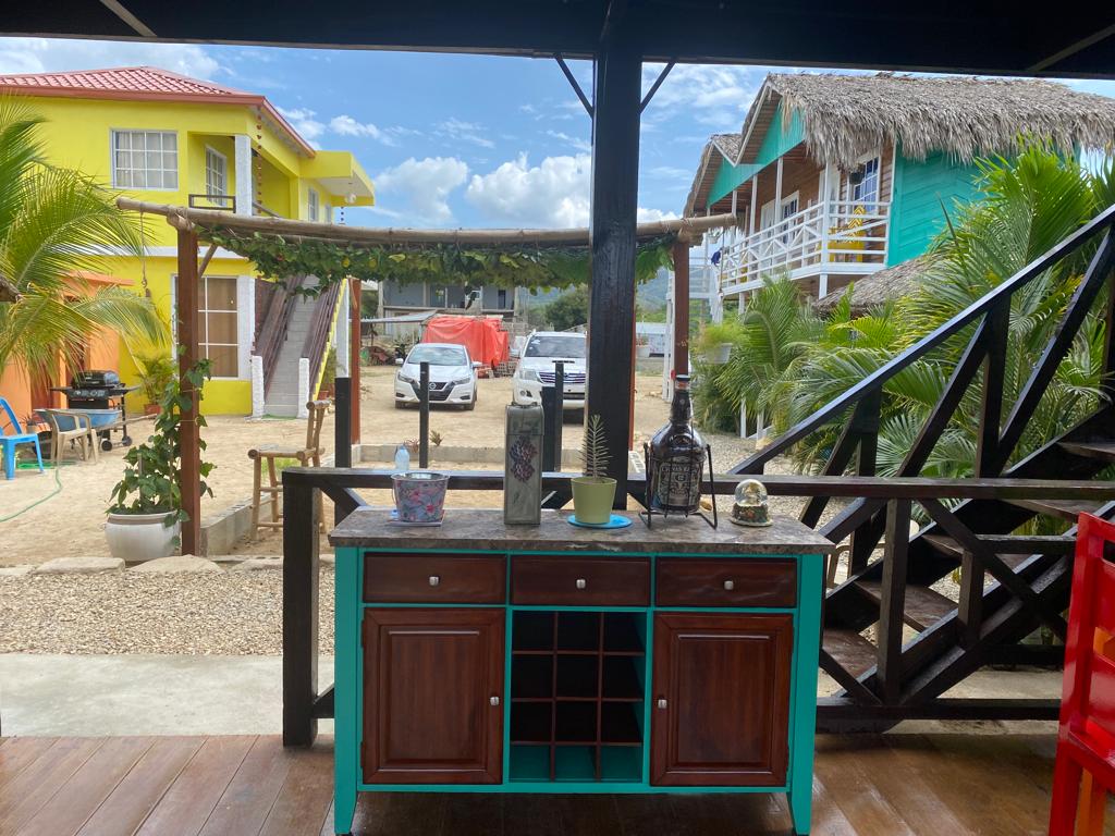 A blue and brown cabinet with a wine rack on it