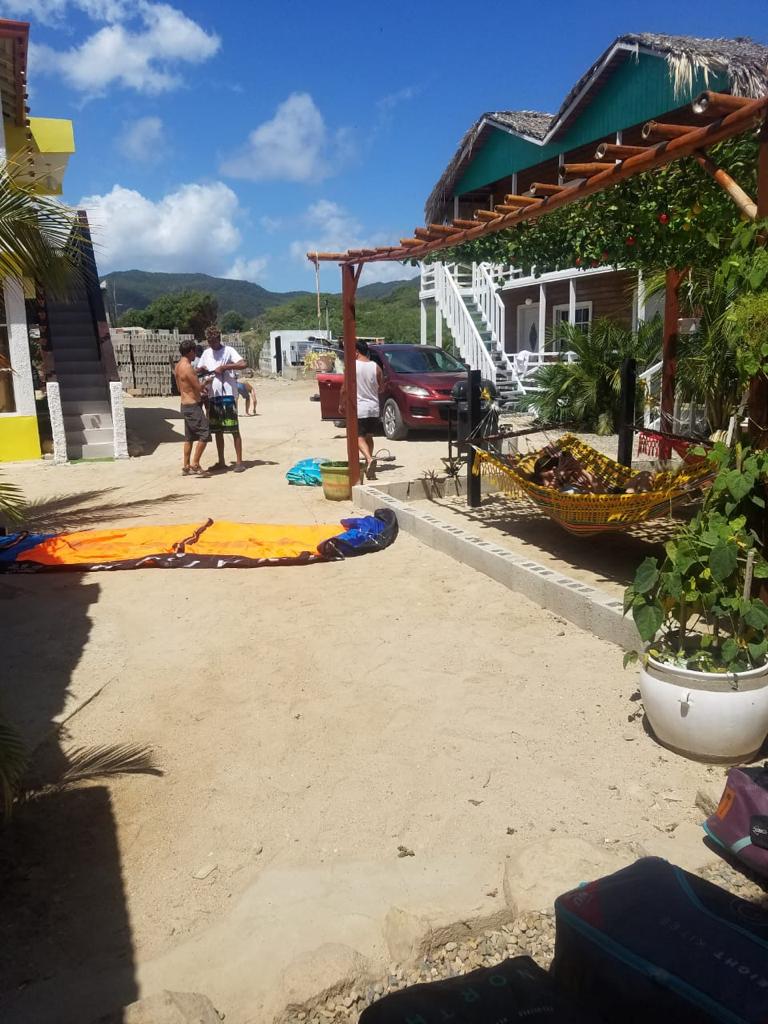 A group of people standing in front of a house