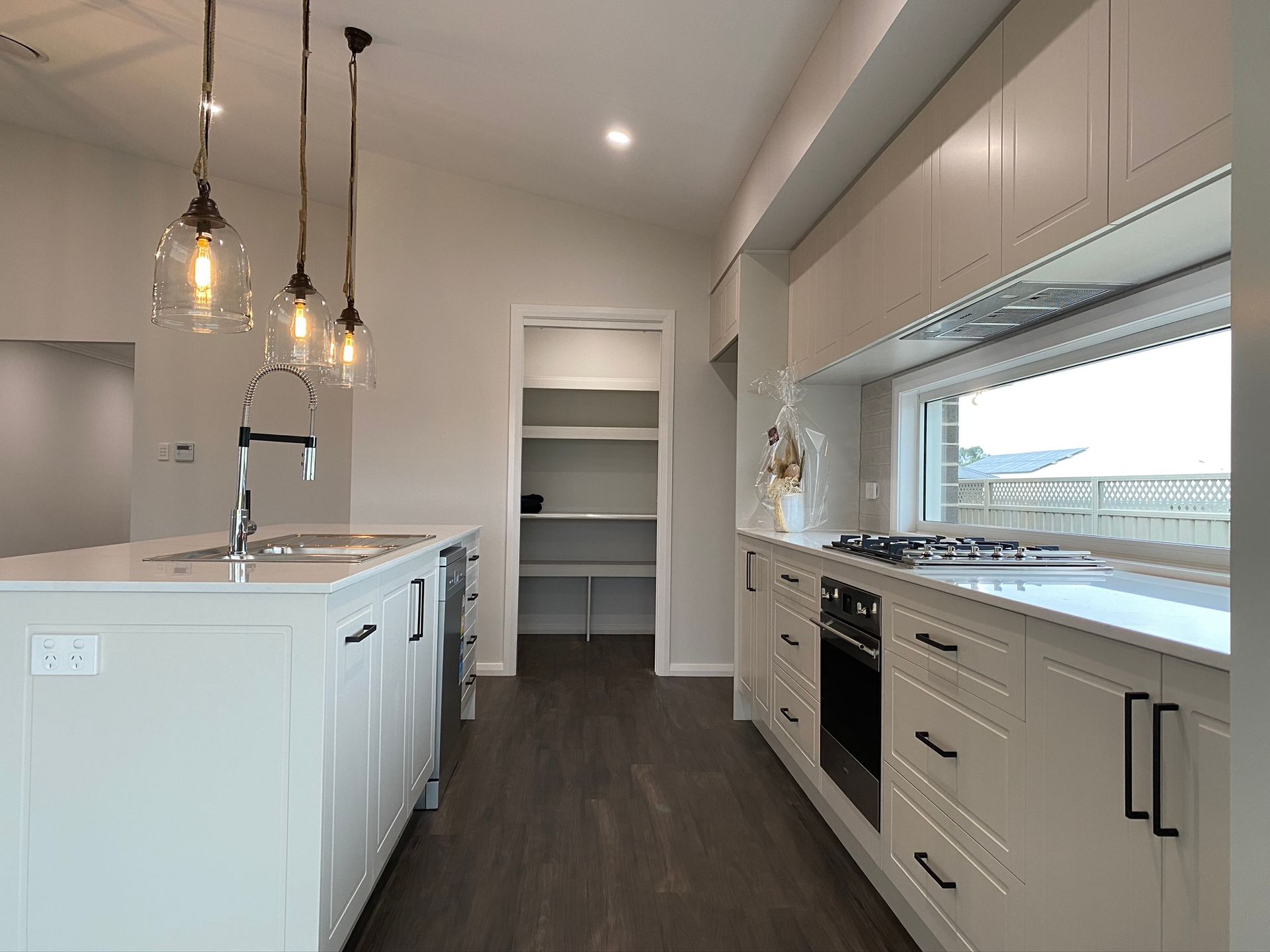 Modern Kitchen Through The Hallway — Kitchen Renovations in Dubbo, QLD