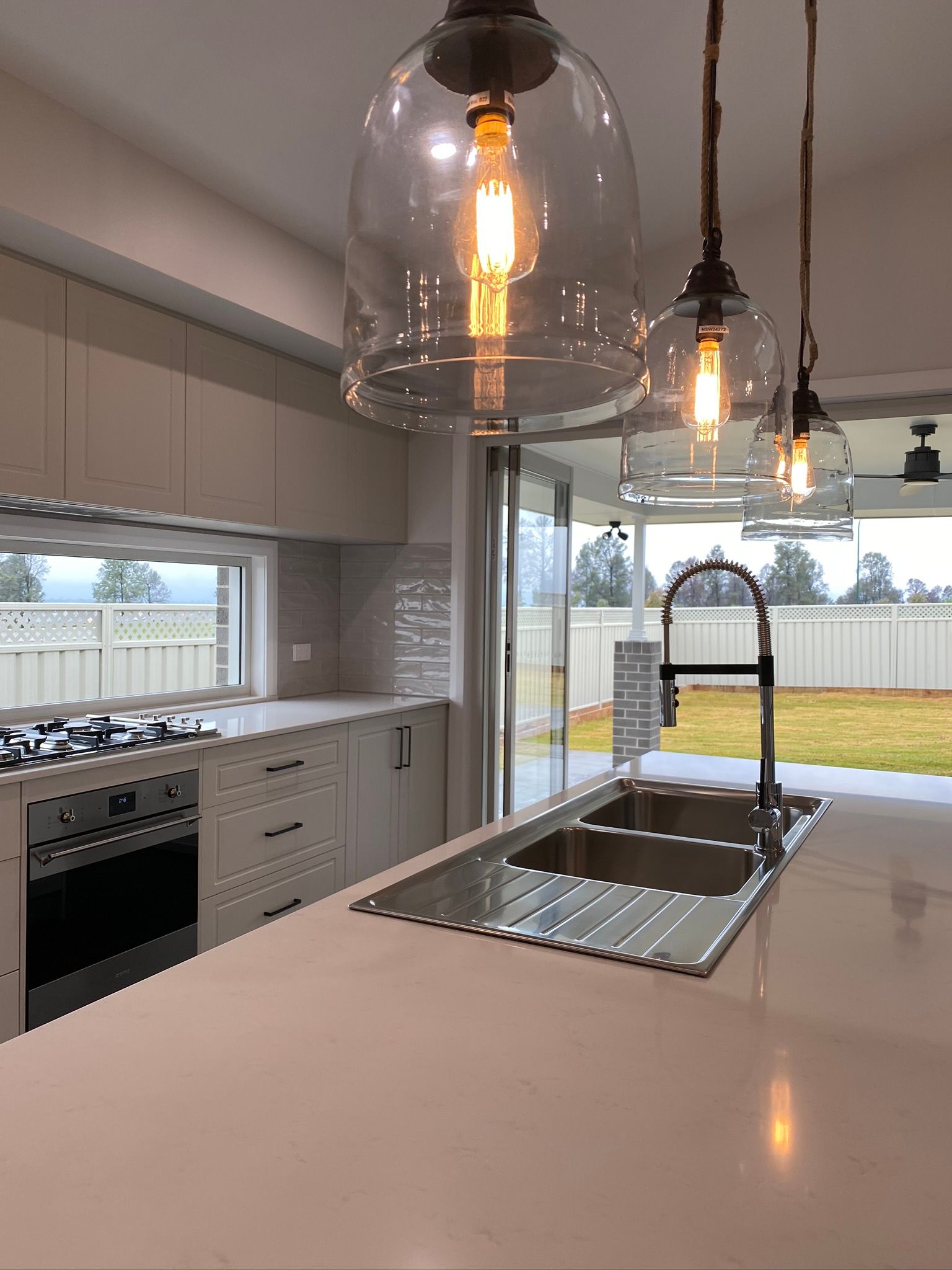 Modern Style of Kitchen Sink and Pendant Light — Kitchen Renovations in Dubbo, QLD