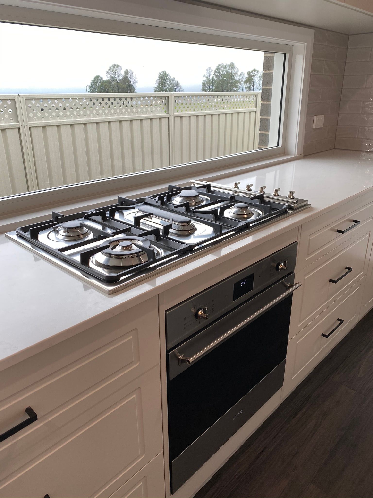 Gas Stove on a White Countertop — Kitchen Renovations in Dubbo, QLD