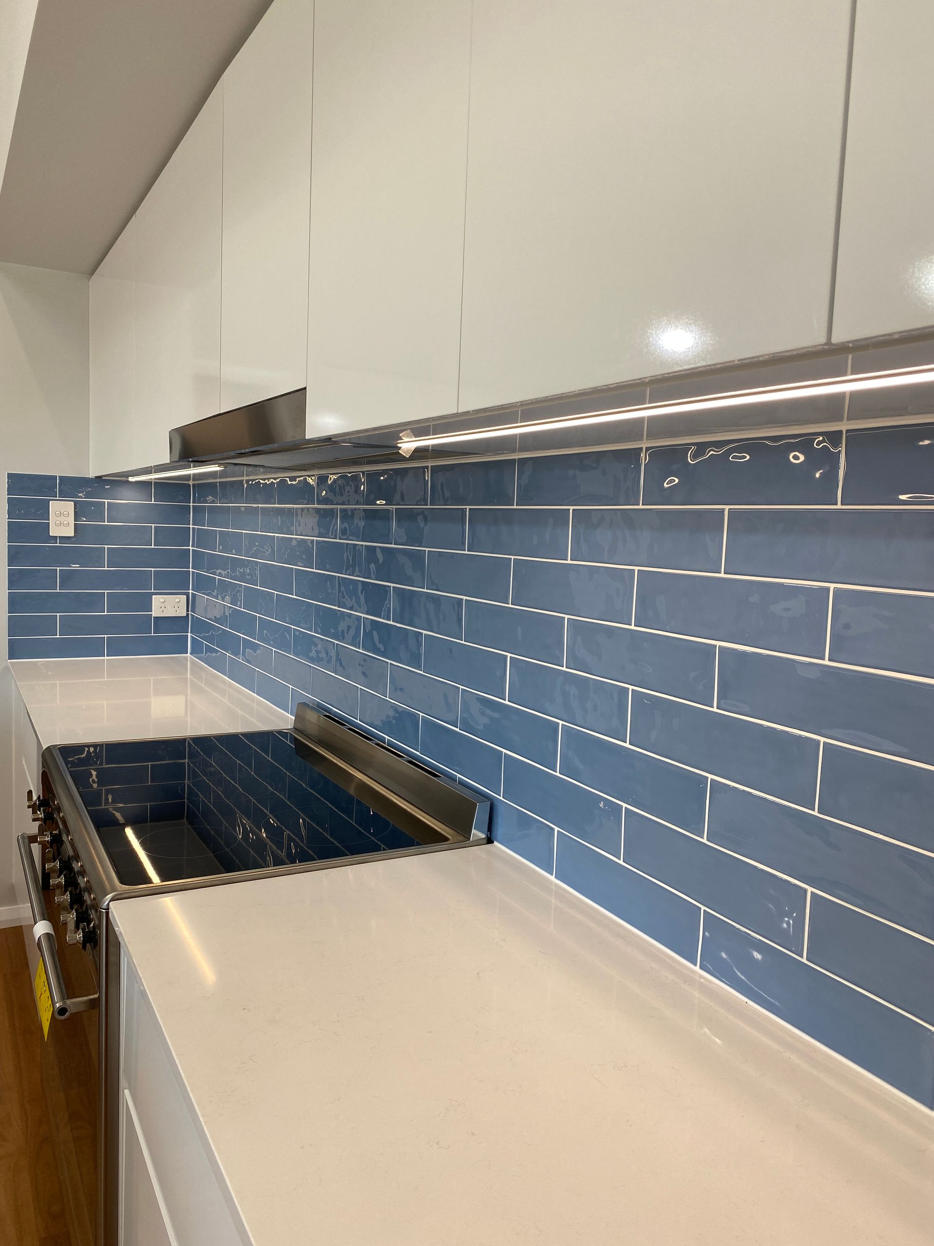 Side View Photo of a Blue Subway Tiles From Kitchen — Kitchen Renovations in Dubbo, QLD