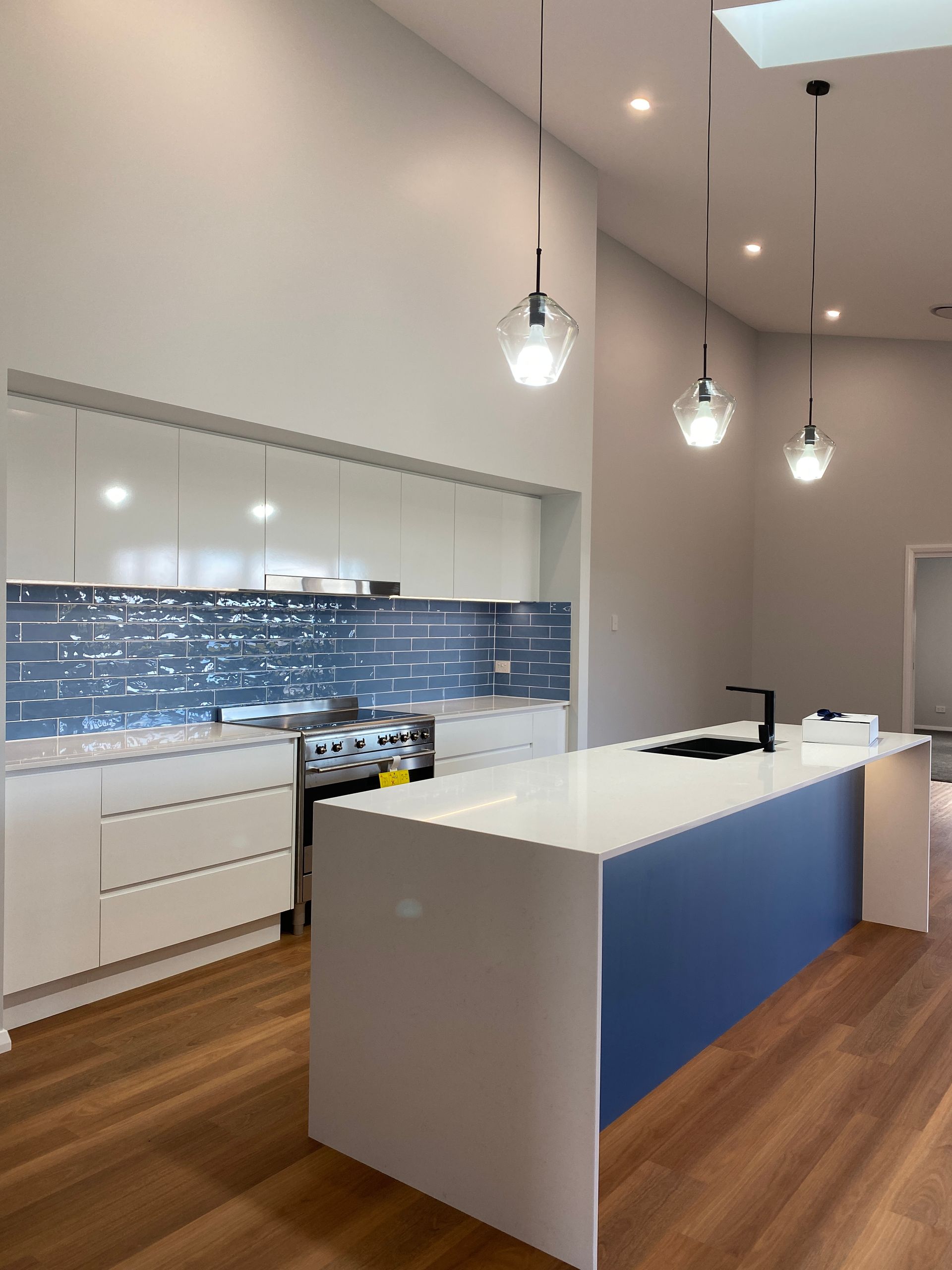 Blue Kitchen With White Cabinetry — Kitchen Renovations in Dubbo, QLD