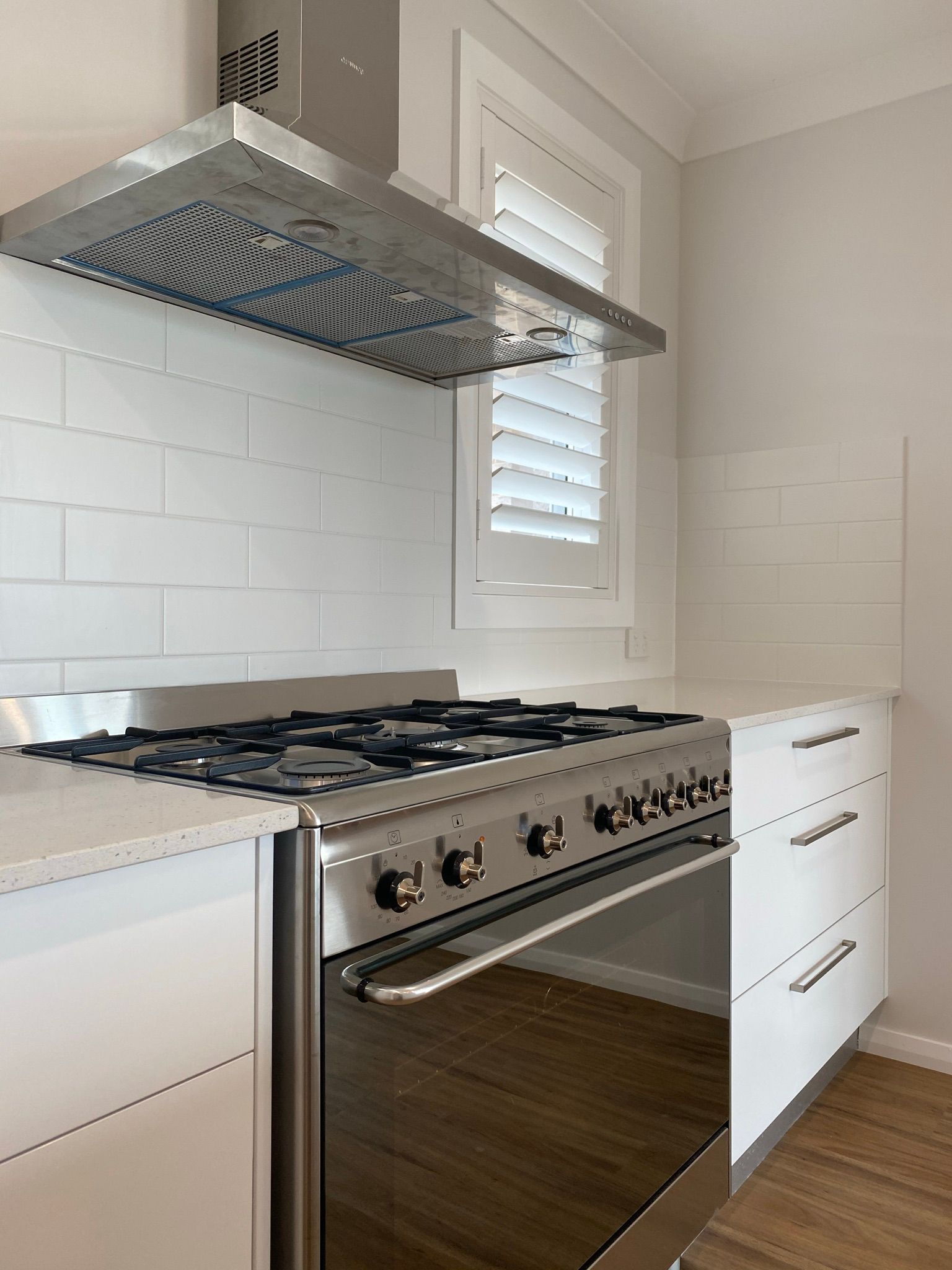 Gas Stove on White Kitchen — Kitchen Renovations in Dubbo, QLD