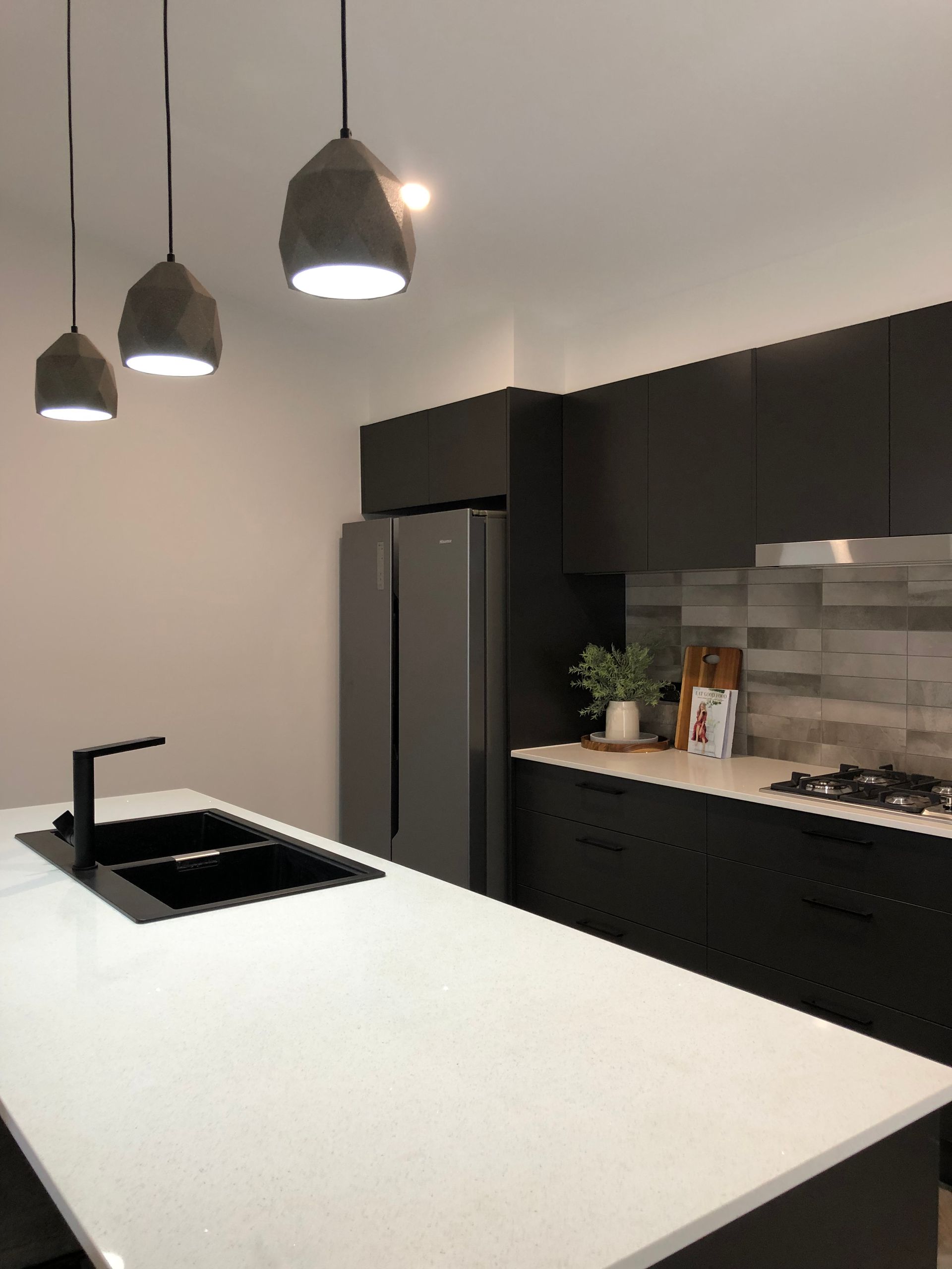 Kitchen Interior With Black Sink and Cabinets — Kitchen Renovations in Dubbo, QLD