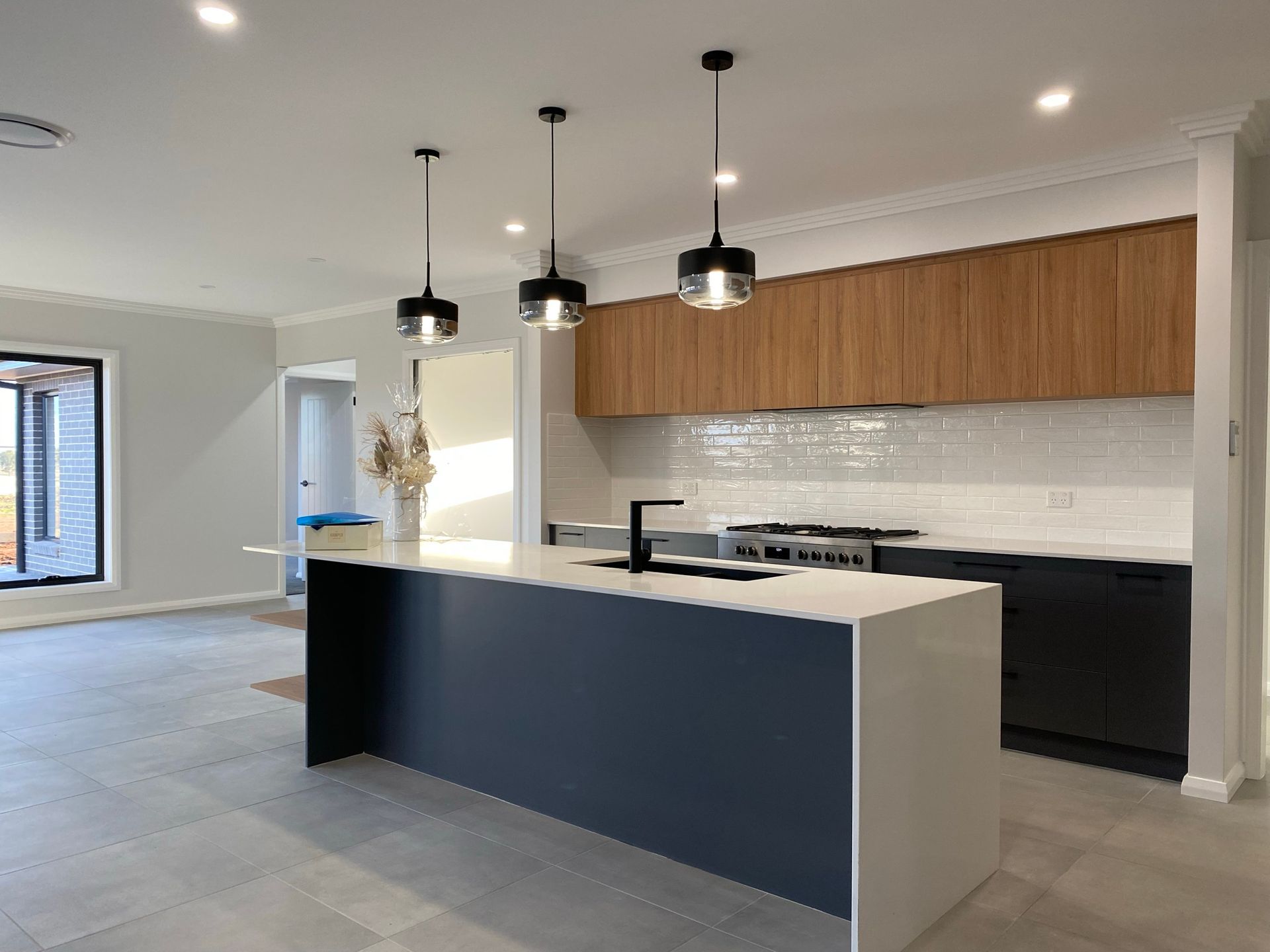 White and BLue Kitchen With Wooden Cabinets — Kitchen Renovations in Dubbo, QLD