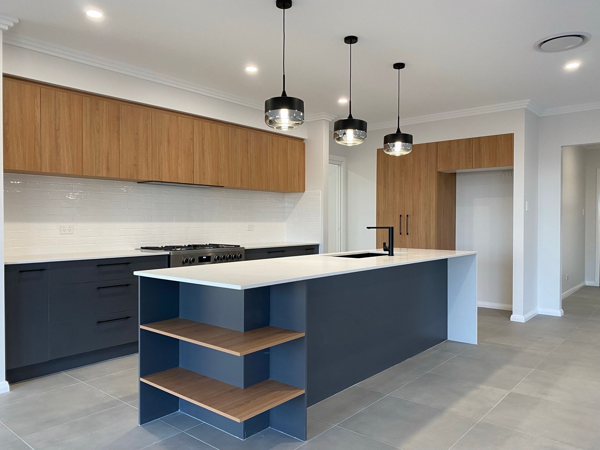 A Luxurious White and Blue Kitchen — Kitchen Renovations in Dubbo, QLD