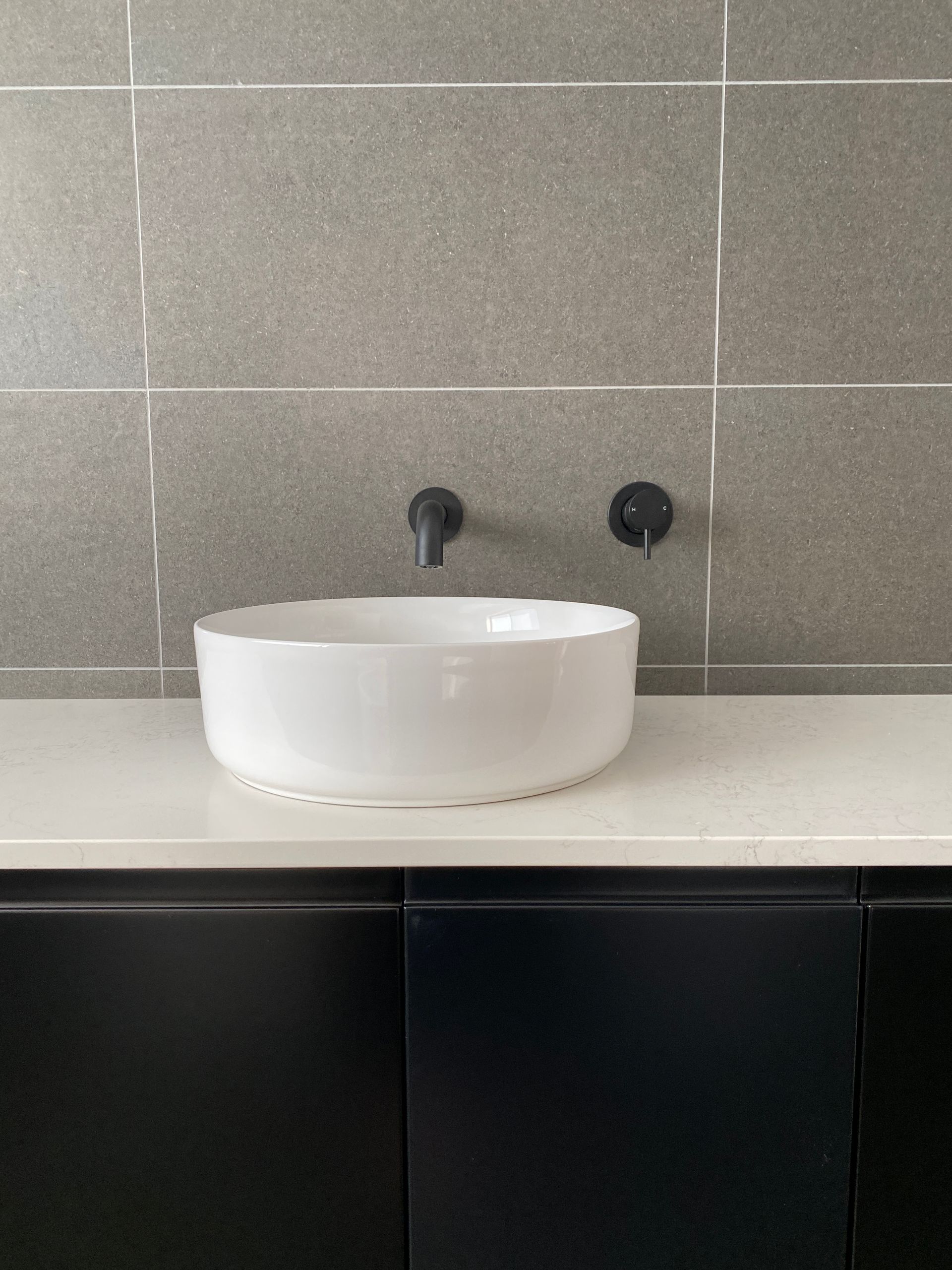 White Round Washbasin With Balck Faucet — Kitchen Renovations in Dubbo, QLD
