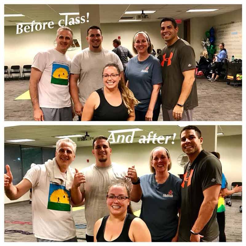 A group of people posing for a picture before and after class