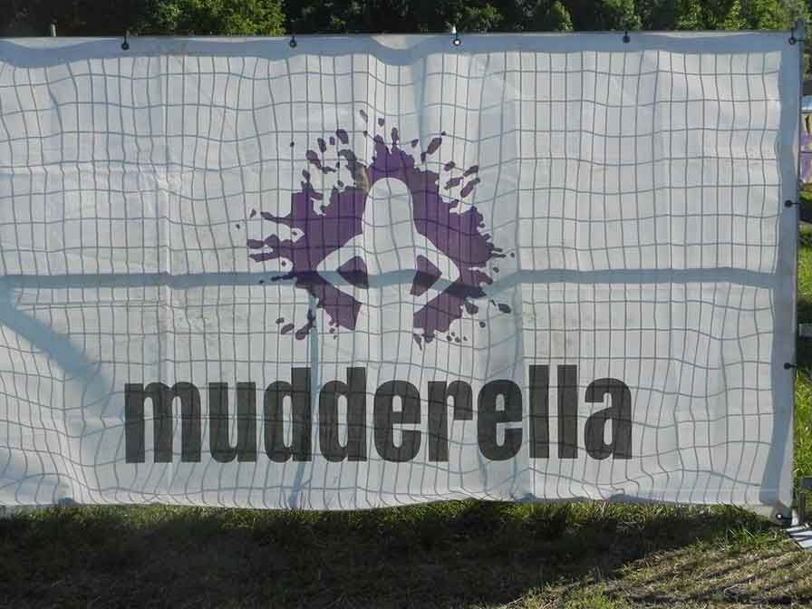 A white banner with the word mudderella on it
