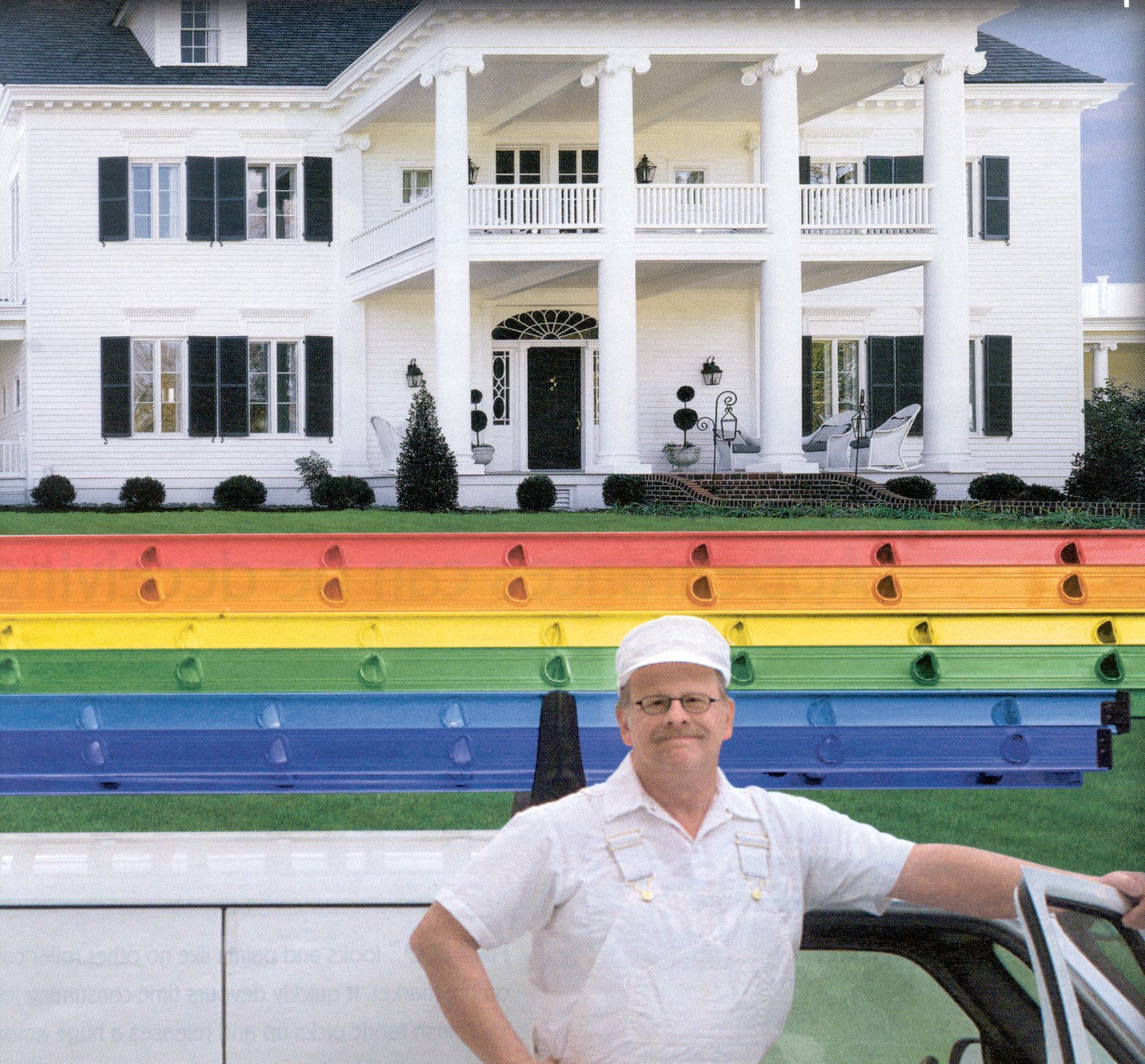 A man standing in front of a white house with a rainbow in the background