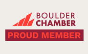 Boulder Chamber “Proud Member” logo in red, maroon, and gray on a light background