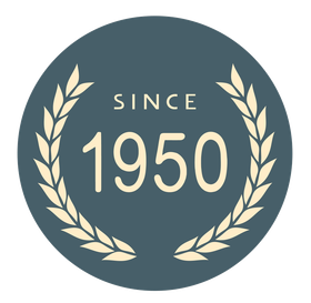 Vintage-style badge with laurel wreath and the text “Since 1950” on a dark teal circle.