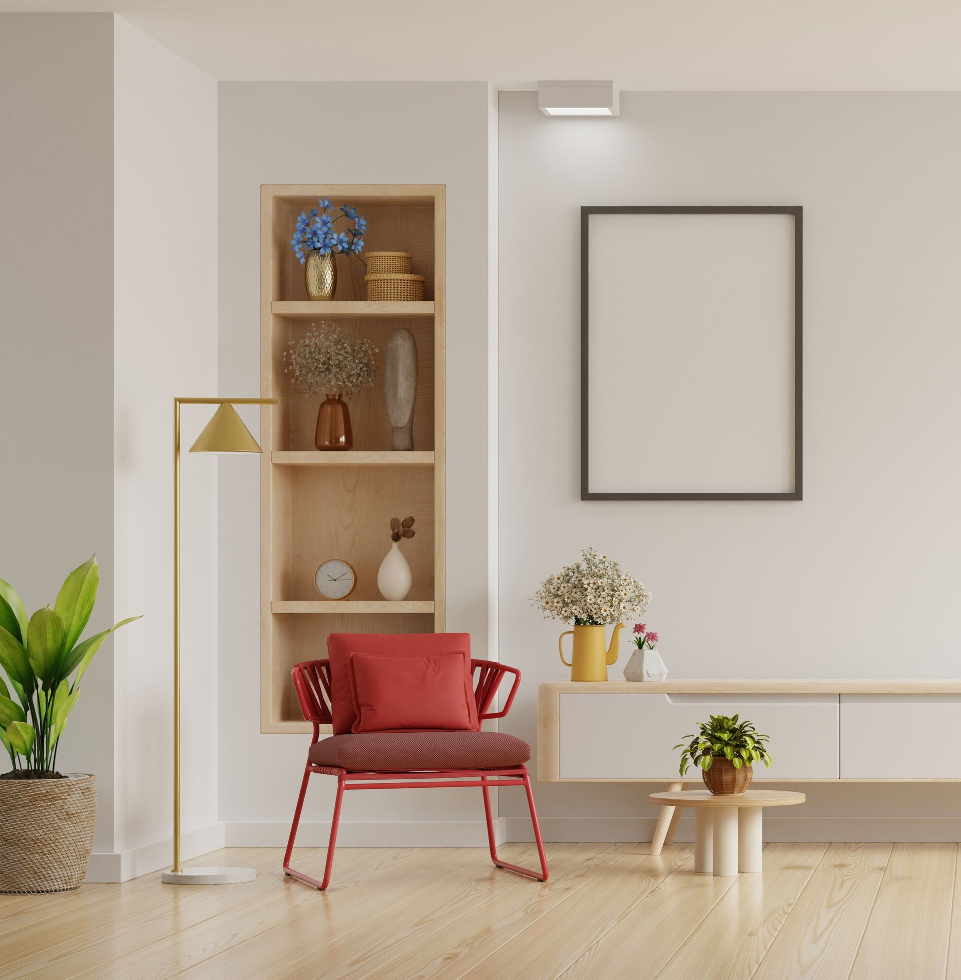 a living room with a red chair , a lamp , a picture frame on the wall and a wooden floor