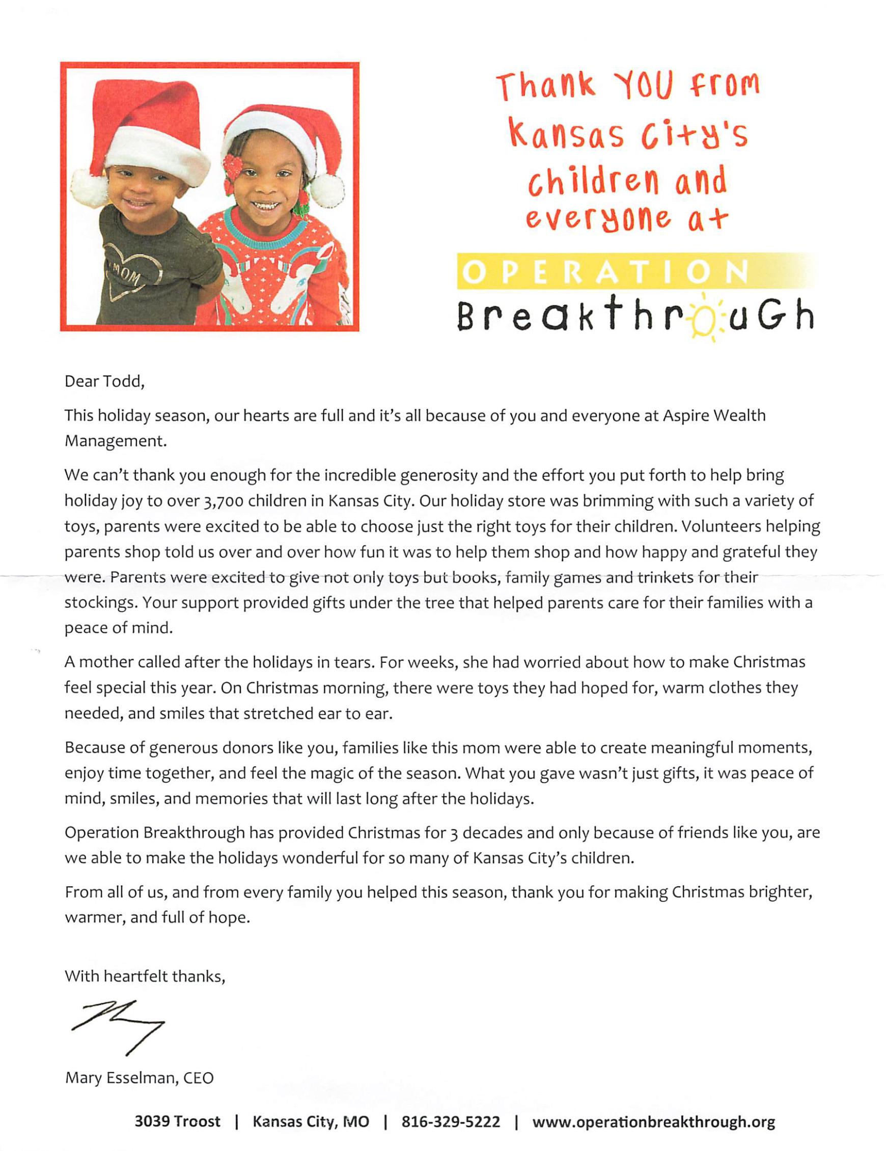 Two children in Santa hats; text reads 