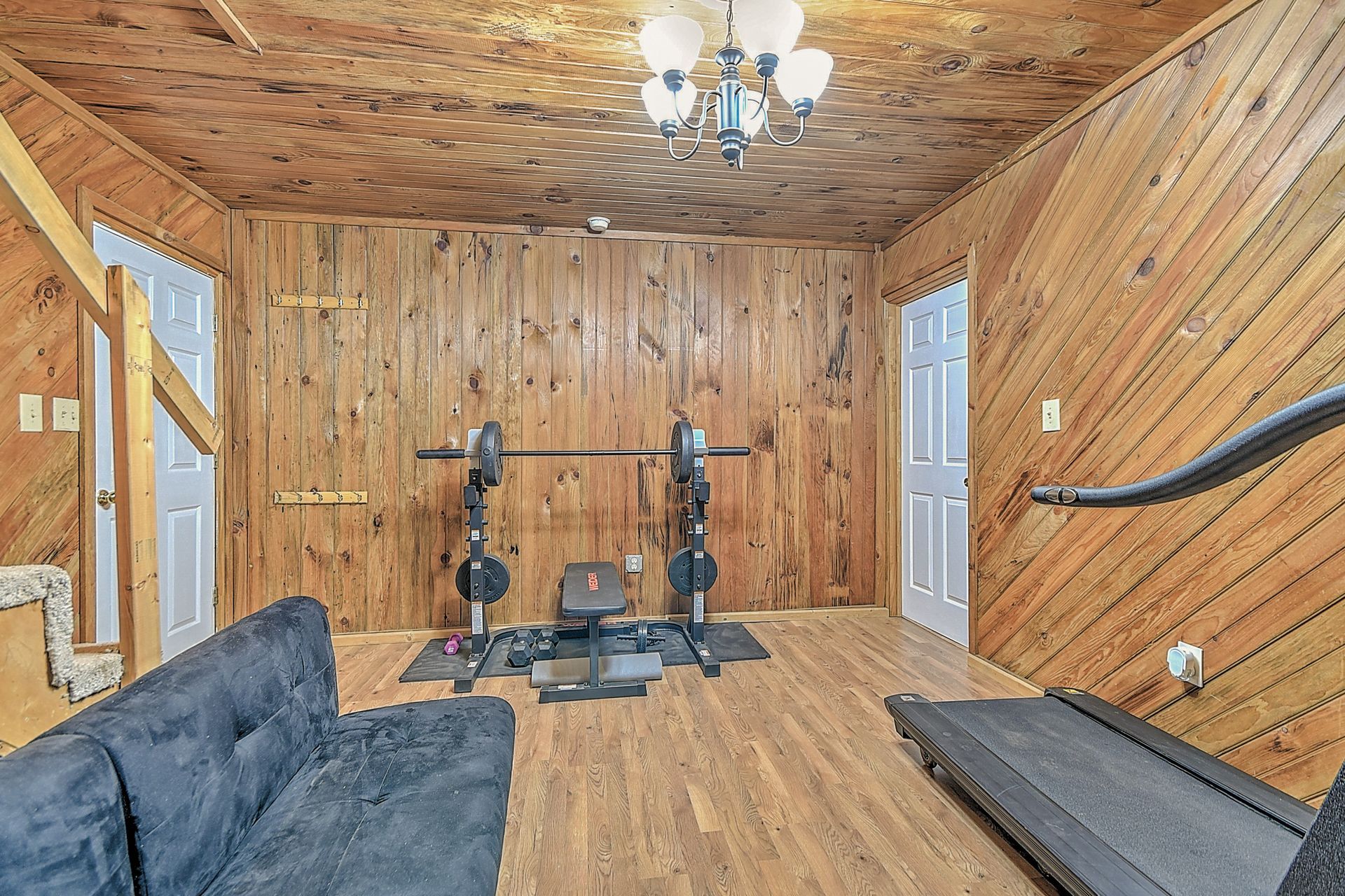 There is a treadmill in the middle of the room.