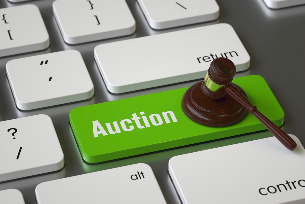 Keyboard with an auction button and a gavel icon