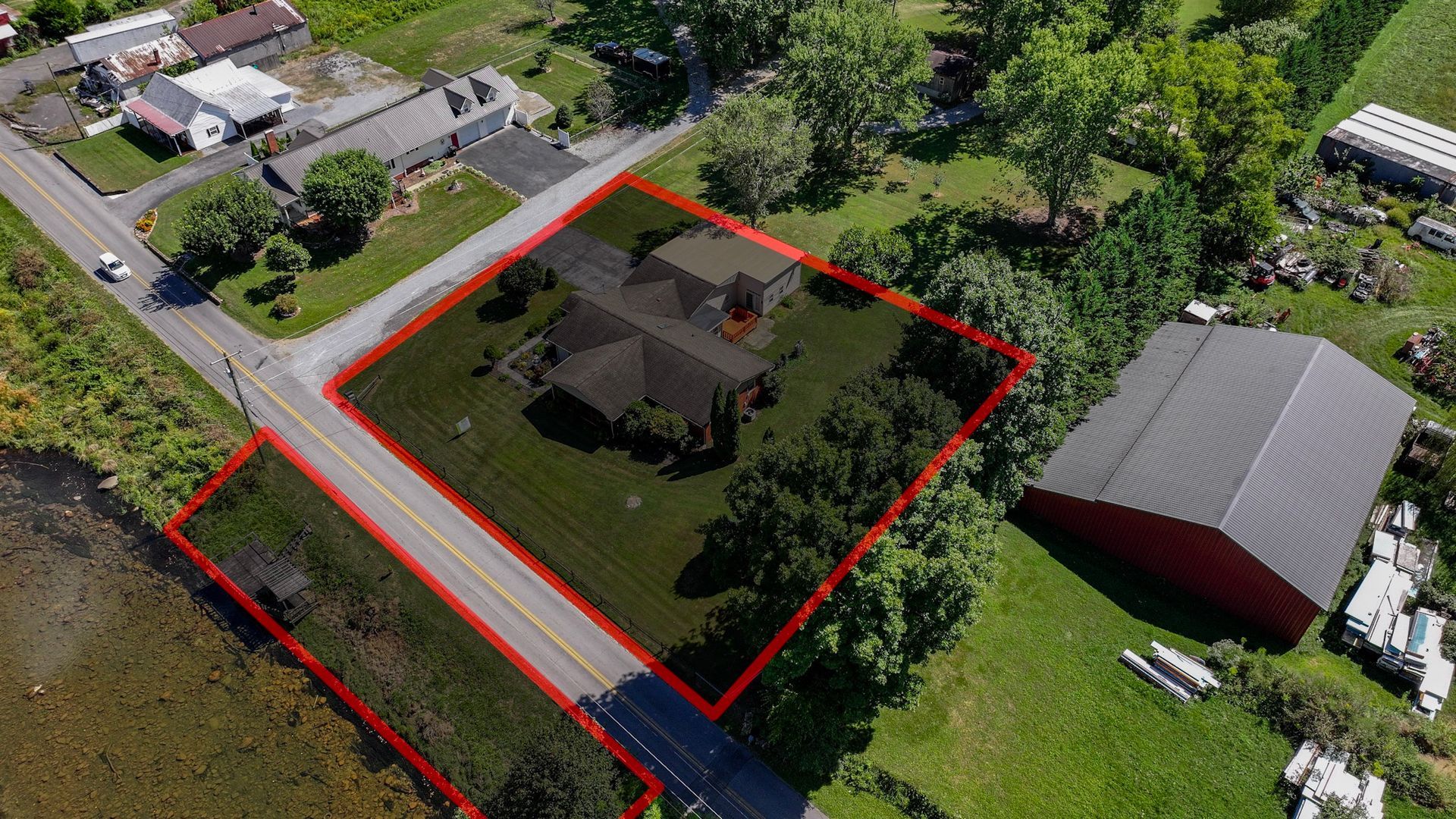An aerial view of a house with a red line around it at 238 Wilbur Dam Rd Elizabethton Tennessee.