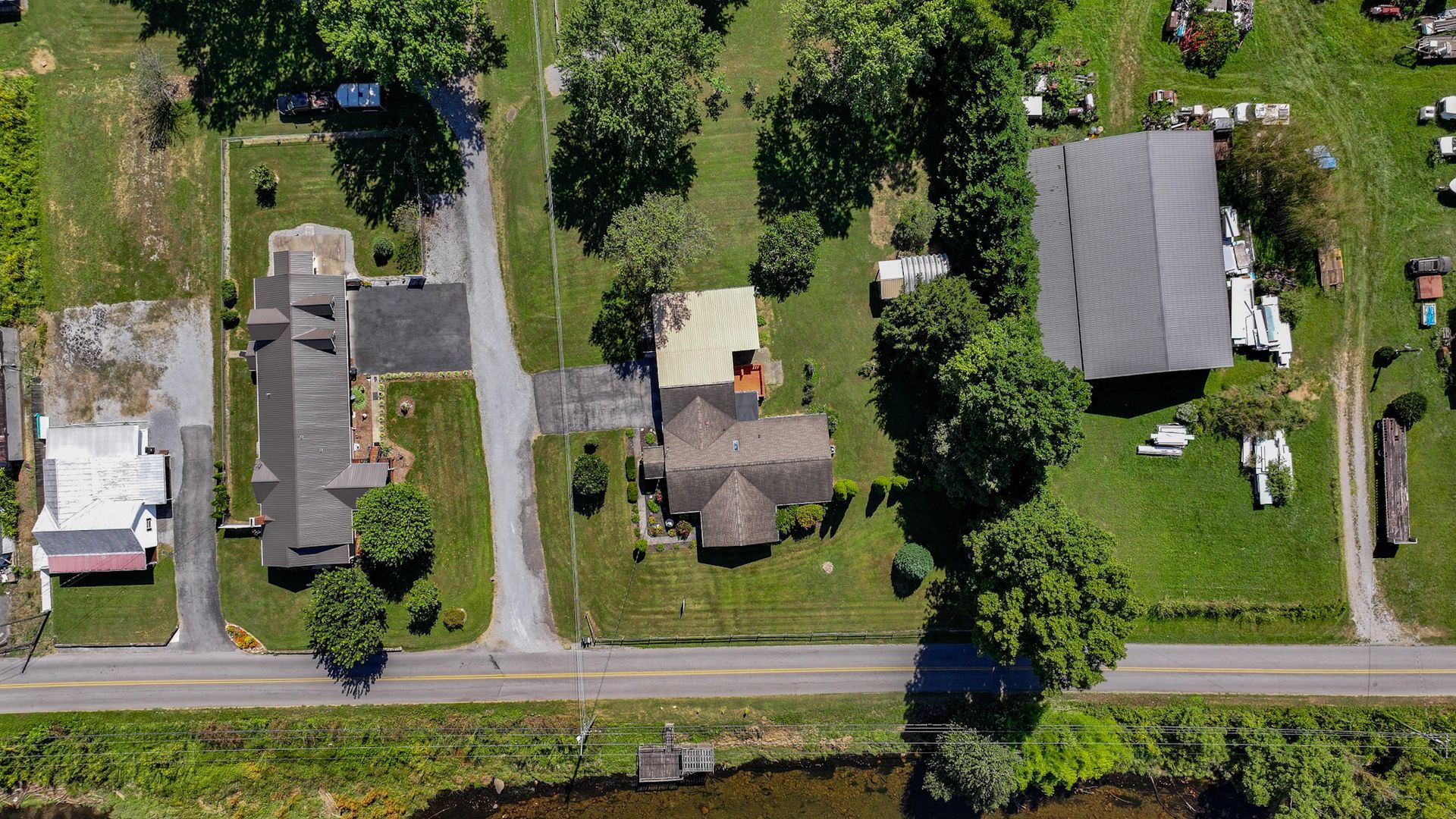 An aerial view of a residential area with lots of houses and trees at 238 Wilbur Dam Rd Elizabethton Tennessee