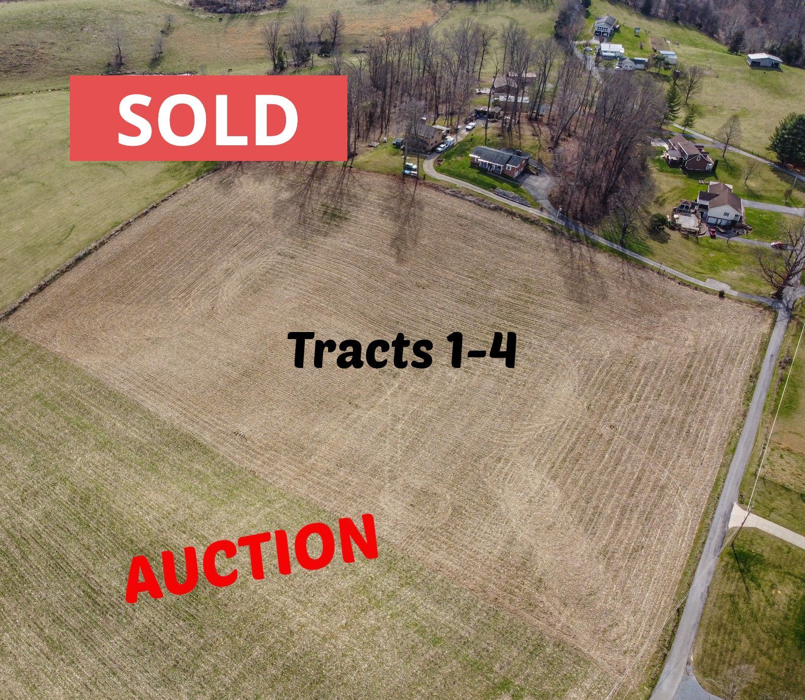 An aerial view of a field with the words sold and auction written on it.