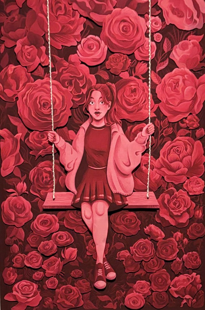 Girl on swing against rose backdrop. Red color scheme.