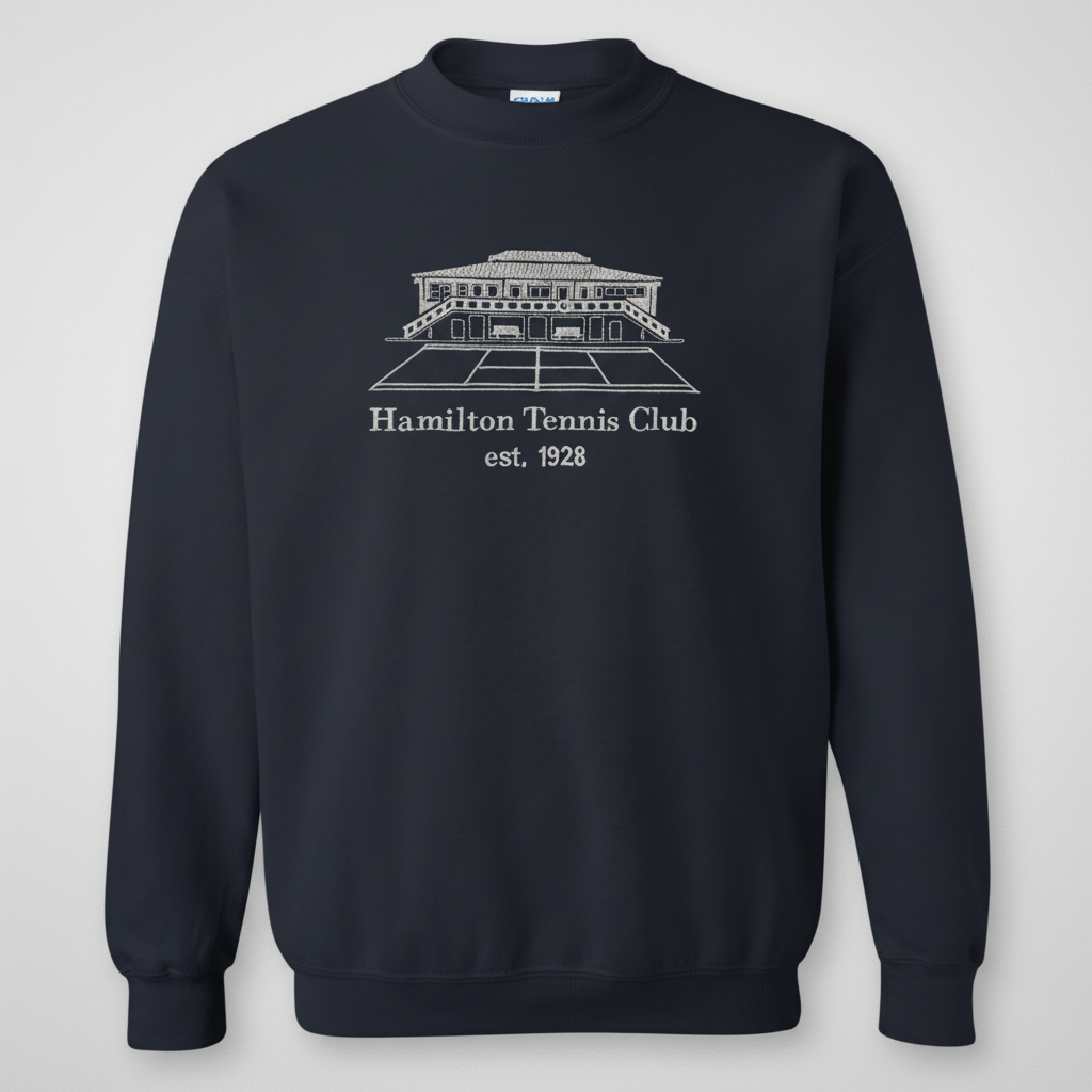 Navy blue sweatshirt with a white illustration of a tennis club and text: Hamilton Tennis Club est. 1928.