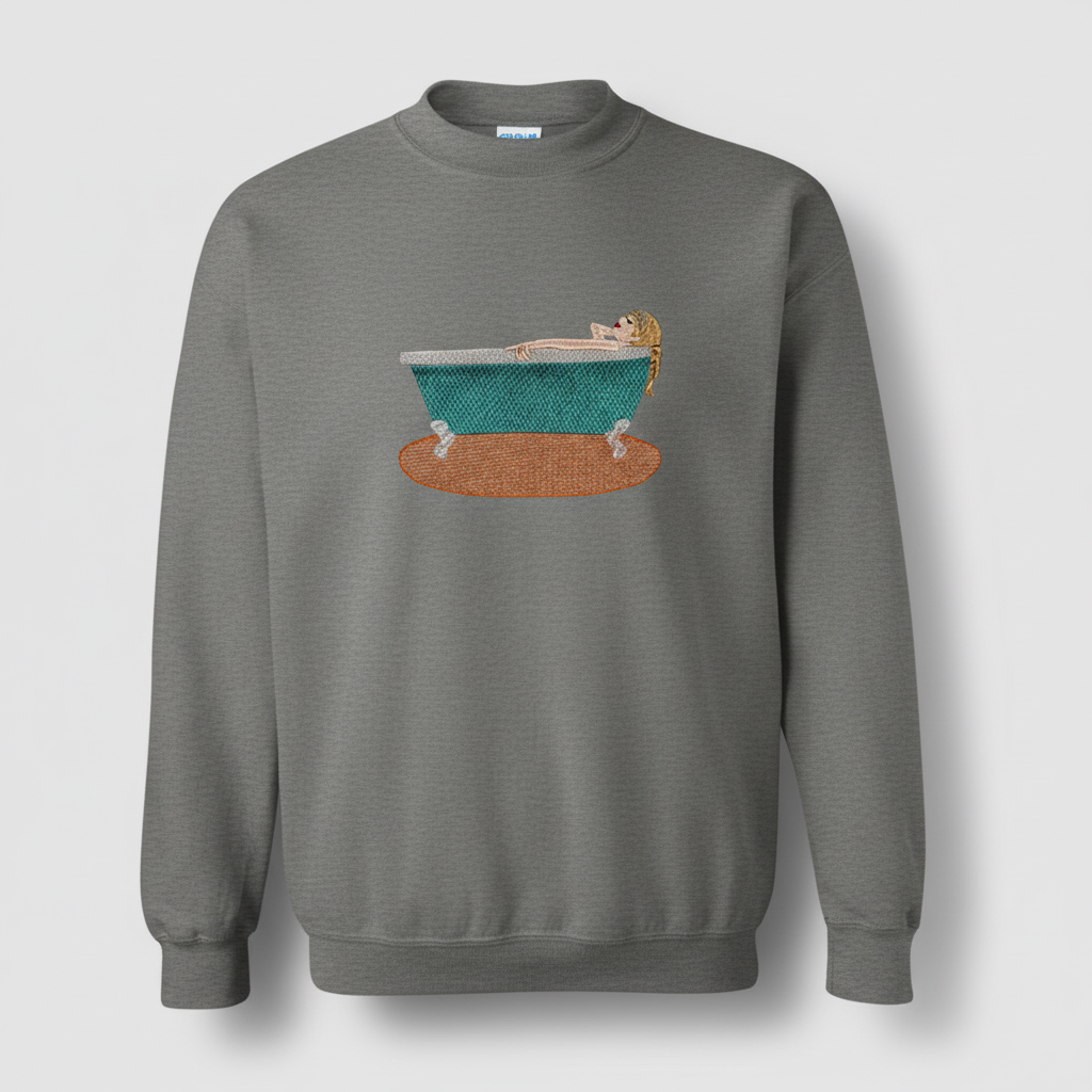 Gray sweatshirt with an embroidered design of a person relaxing in a teal bathtub.