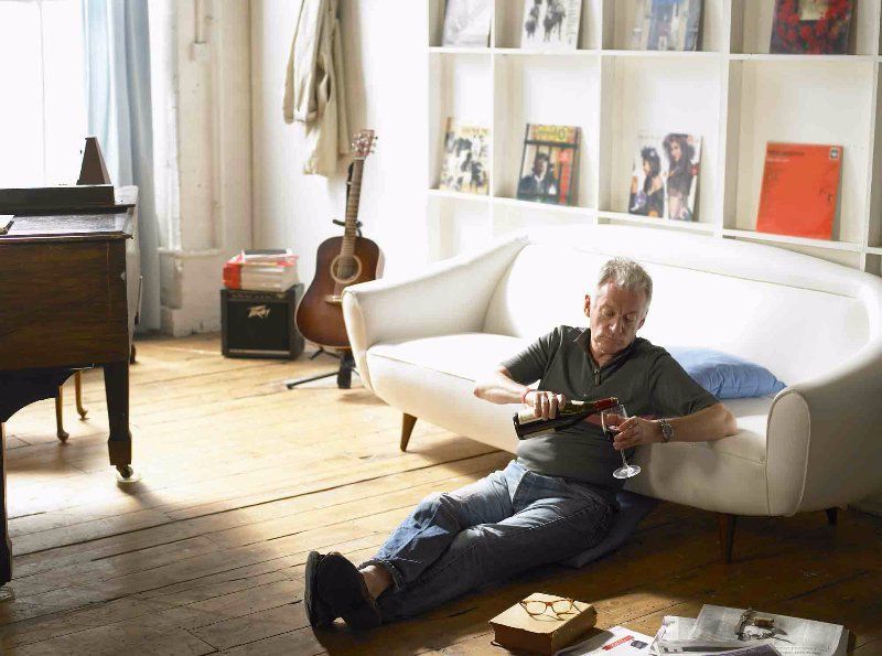 man sitting on a wooden floor