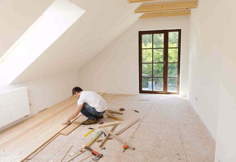 man working on a wooden floor