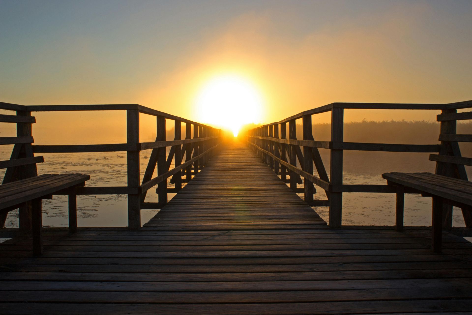 Blog image of a sunset over a pier