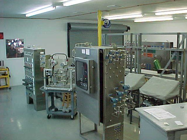 A room filled with lots of stainless steel equipment
